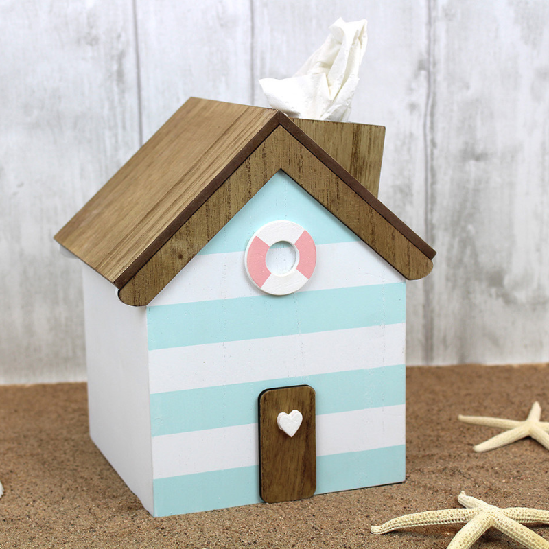 blue and white stripe wooden tissue box cover in the design of a beach hut with brown wooden roof and a little door and life ring on the front