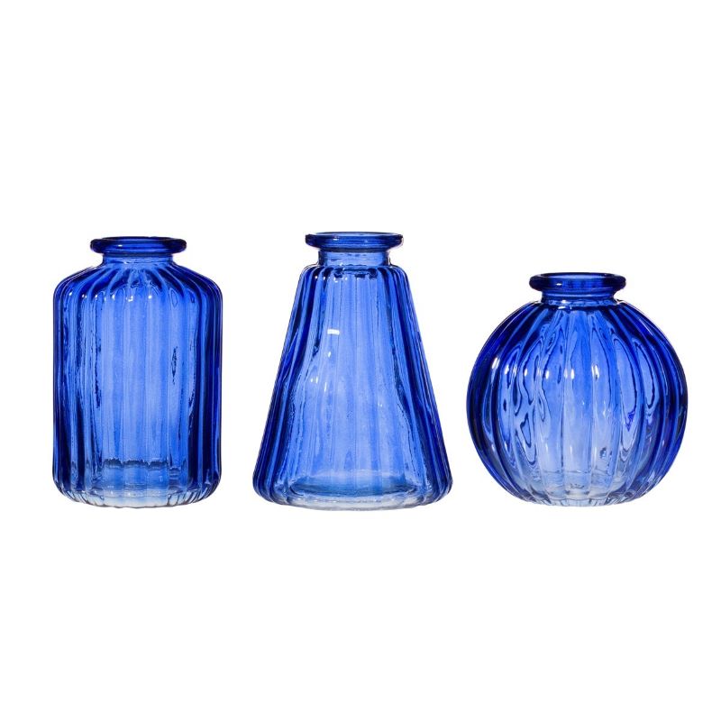 3 different shaped blue glass bud vases with ribbed edges 