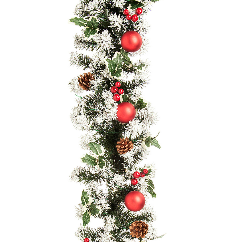 green spruce christmas garlnd with snow tipped finish.  embellished with red baubles, pinecones, red berries and artificial holly.  270 cm long