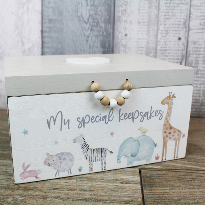 unisex wooden baby keepsake box with grey hinged lid.  The baby keepsake box ahs pictures of animals, including giraffes, elephants and zebras painted around the sides of the box in muted pastel tones