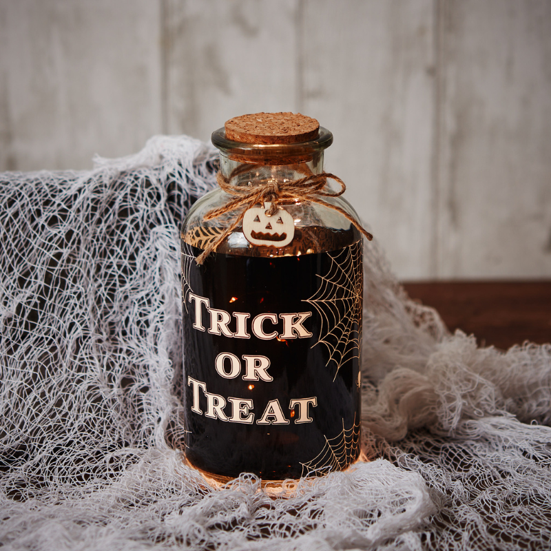 Add a little ghoulish atmosphere to your home this Halloween with the LED light up decorative glass jar from Langs.  The decorative halloween light up bottle has a cork lid and is embellished with jute string and a little wooden pumpkin.